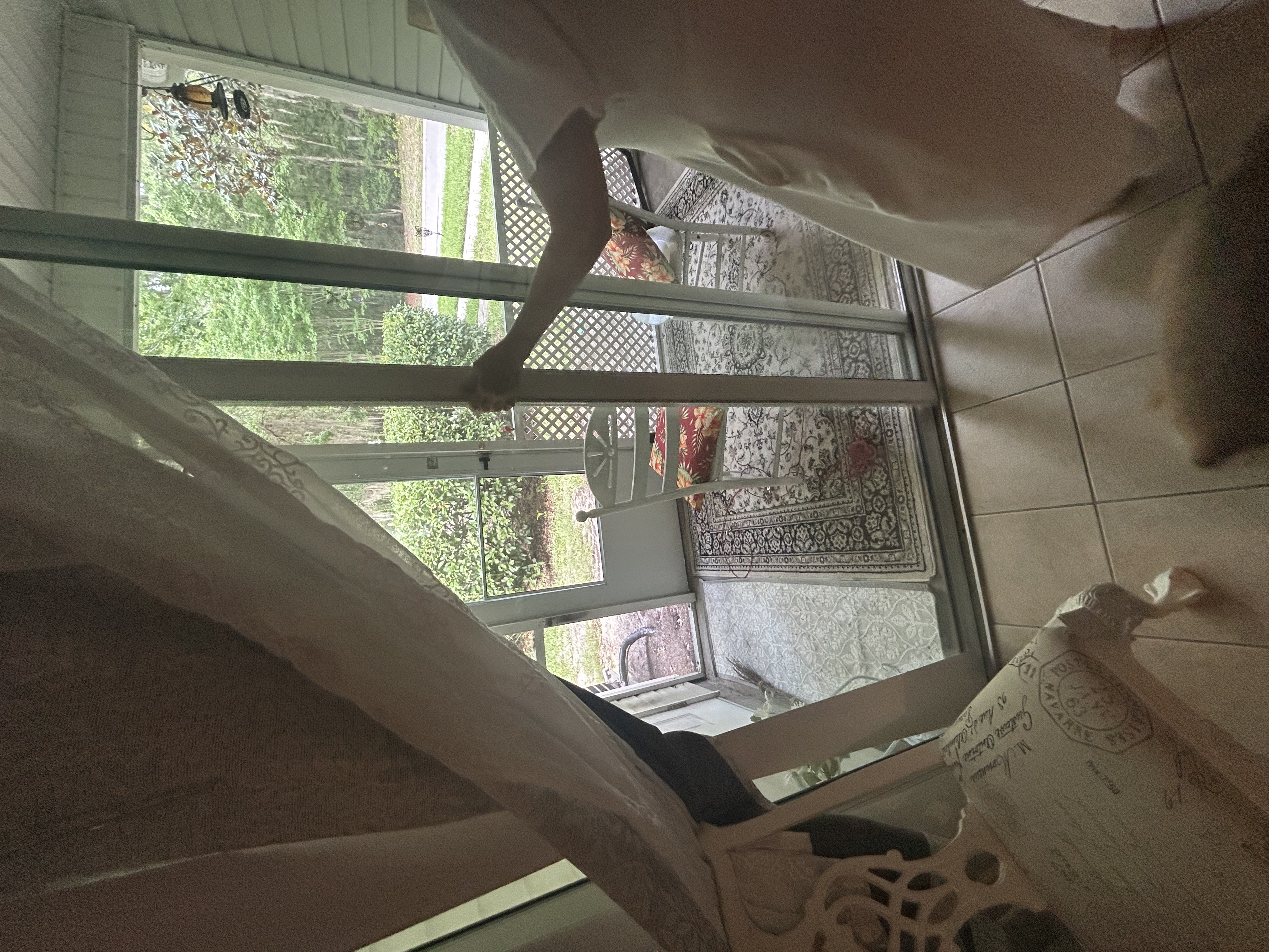 Sliding glass door visibly off its track and misaligned