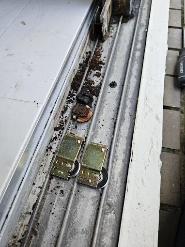 New rollers being installed in sliding door track